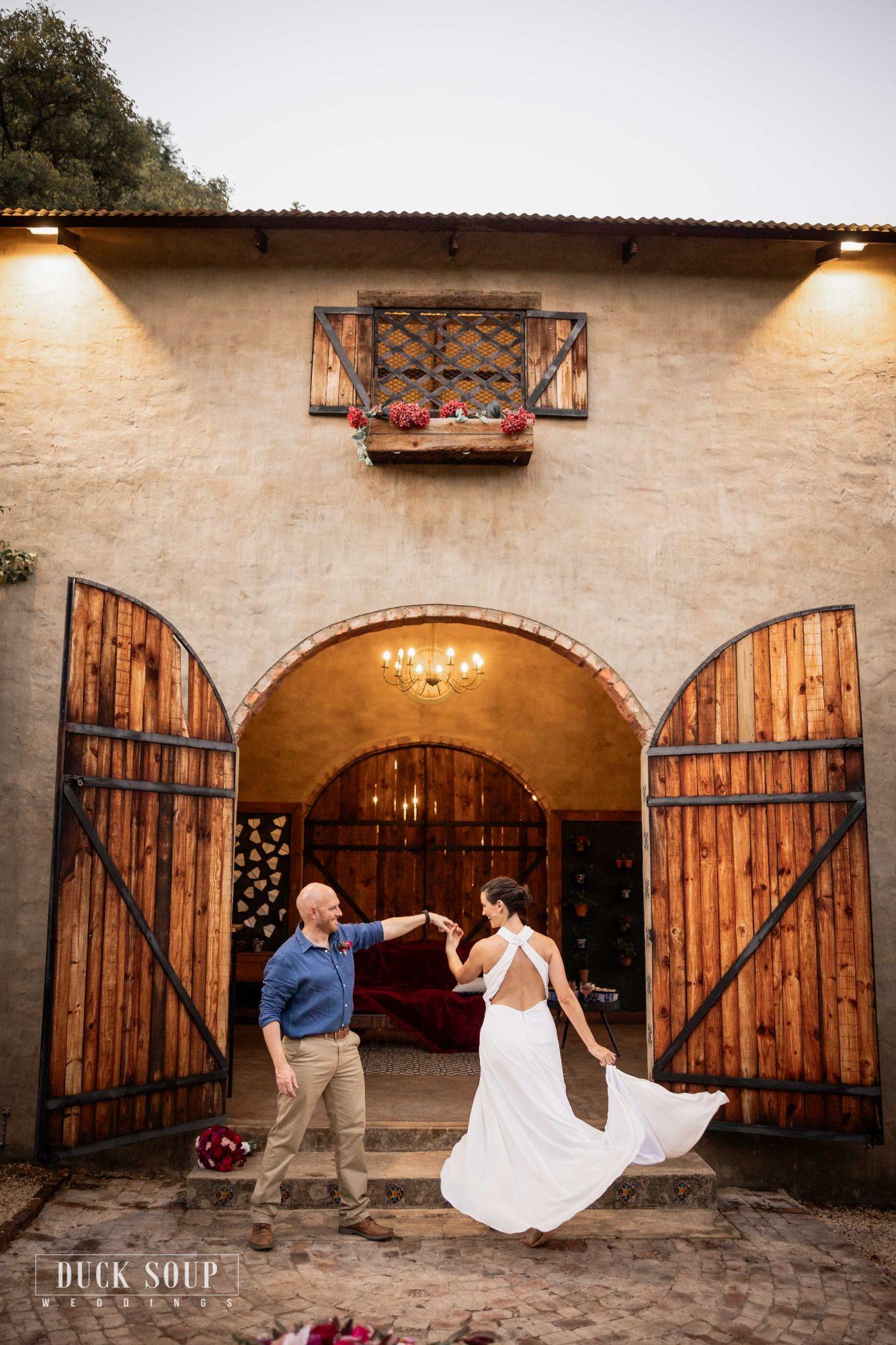 Bernhard and his wife dancing outside the open barn doors on their wedding day